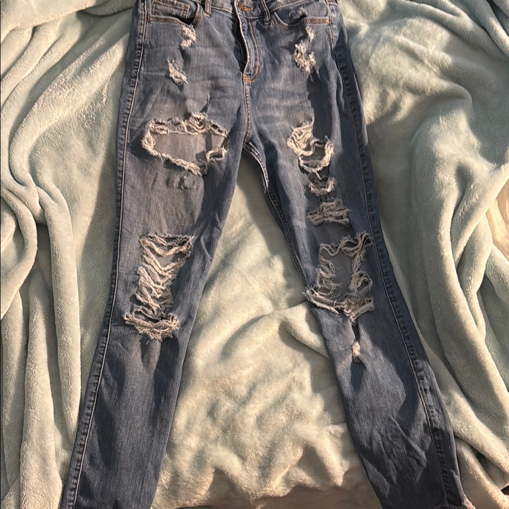Blue Skinny Distressed Jeans with Rips and Fraying